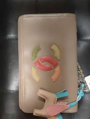 AUTHENTIC CHANEL Beige Leather Clutch with Multicolor Patent Logo, Tassel Charm